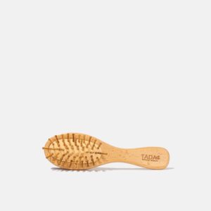 tada-small-natural-wood-hairbrush-on ground